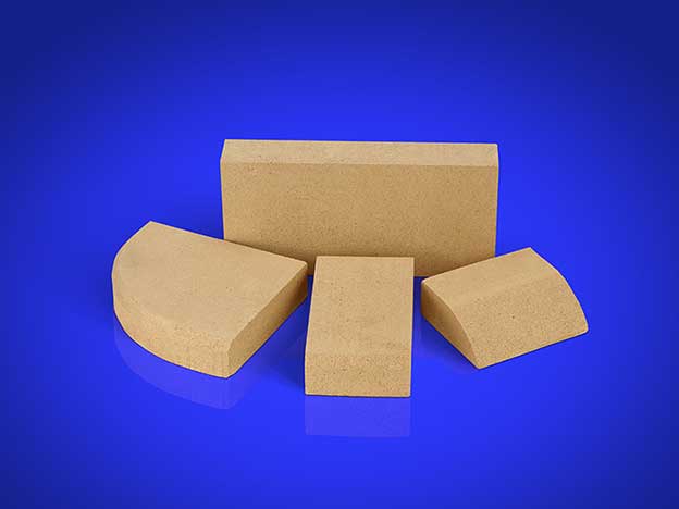 Four different sizes of Fireclay fire bricks displayed on a blue background