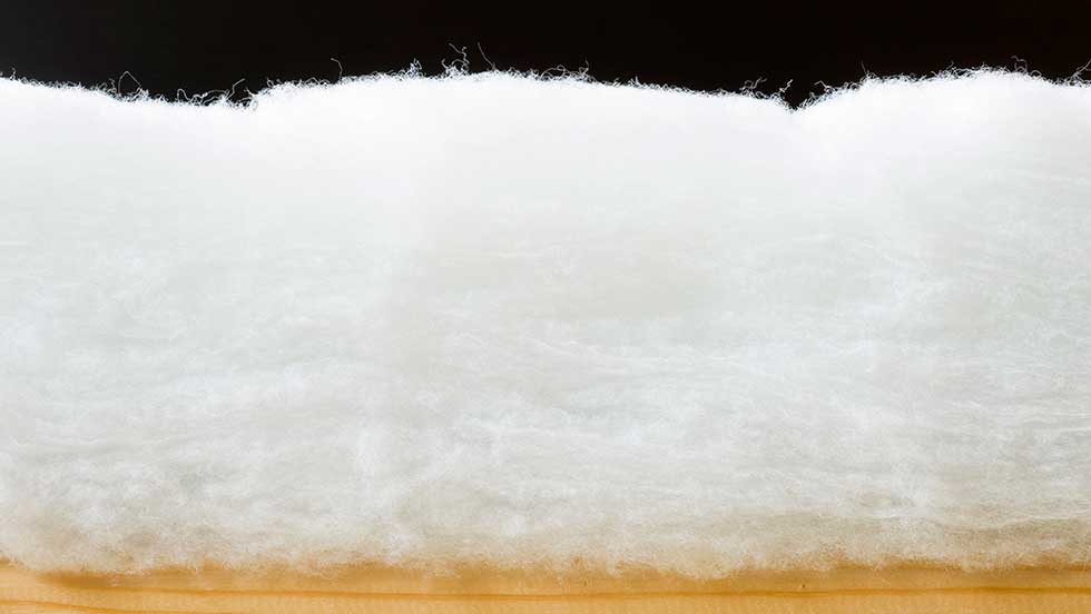 A closeup image of a sheet of fiberglass e glass refractory insulation.