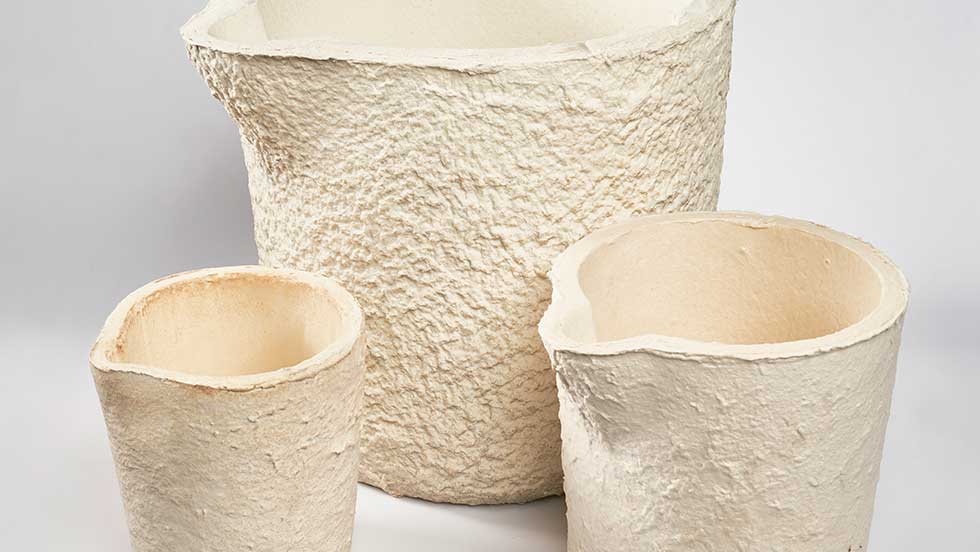 Three refractory ladle liners of different sizes, made using a vacuum form casting process.